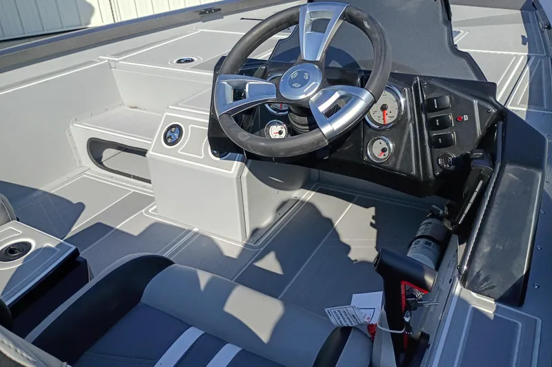 Slide: The Image of 2026 G3 1710SE boat interior with steering wheel and dashboard controls. - 7