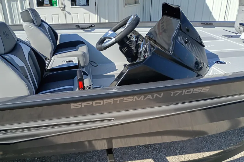 Slide: The Image of 2026 G3 Sportsman 1710SE boat interior with steering wheel and seating. - 8
