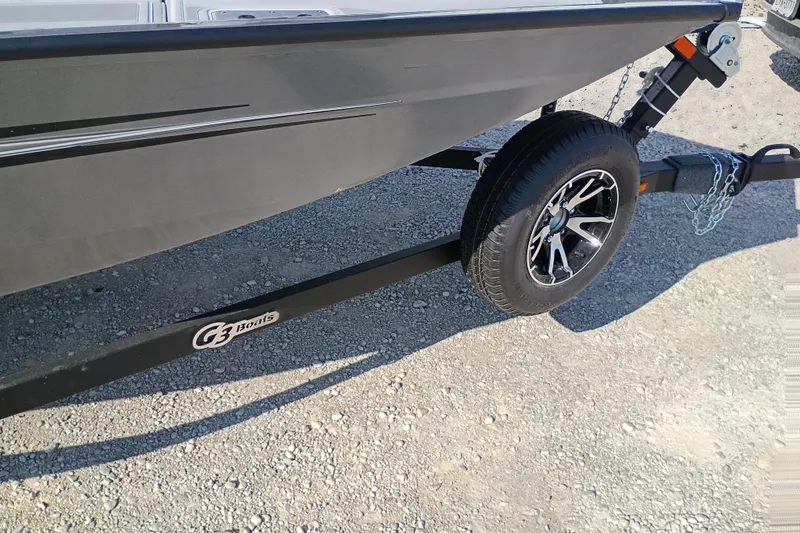 Slide: The Image of Trailer of 2026 G3 1710SE boat on gravel surface. - 9