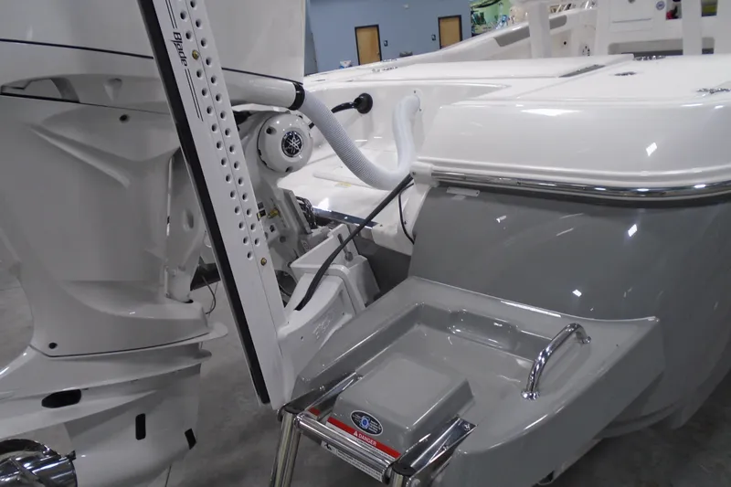 Slide: The Image of 2026 Caymas 24 HB boat with Yamaha engine and power pole, detailed view. - 9