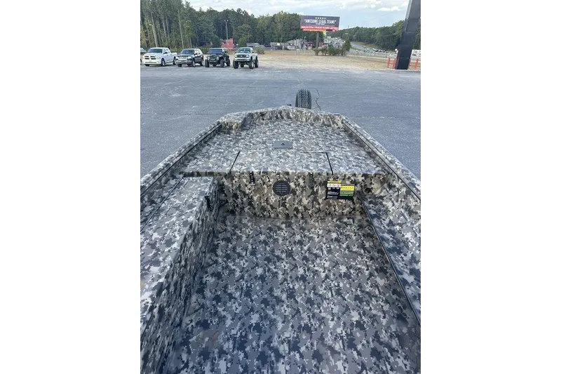 Slide: The Image of 2025 Havoc 1756 boat with digital camouflage design in a parking lot. - 4