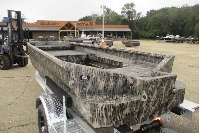 Slide: The Image of 2026 Reaper Boats 653-1690 model with camouflage design at Dockside Marine. - 1