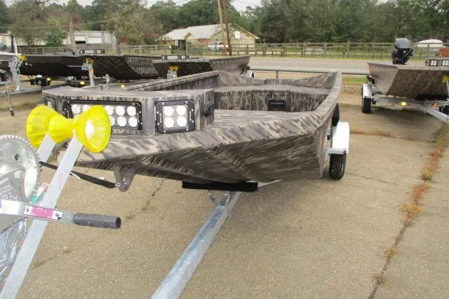 Slide: The Image of 2026 Reaper Boats 653-1690 on trailer, featuring camouflage design and LED lights. - 3