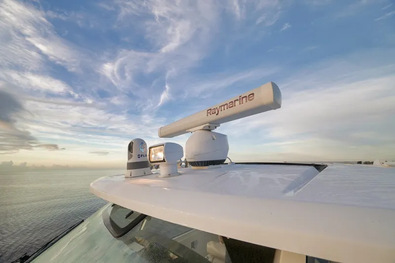 Slide: The Image of Boston Whaler 380 Realm 2020 with Raymarine radar against a scenic ocean backdrop. - 12