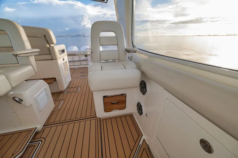 Slide: The Image of 2020 Boston Whaler 380 Realm interior with luxurious seating and ocean view. - 15