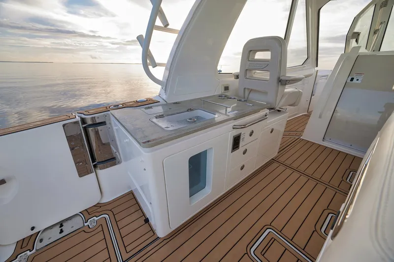 Slide: The Image of 2020 Boston Whaler 380 Realm interior with sleek design and ocean view. - 21