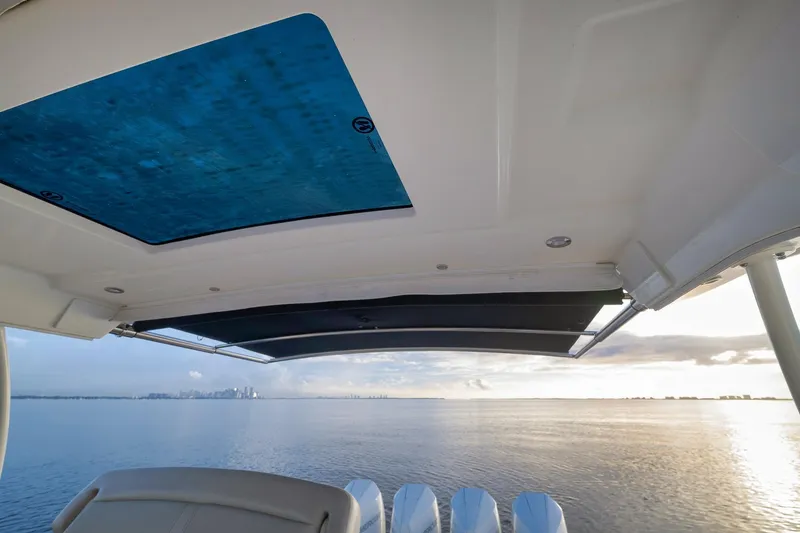 Slide: The Image of Boston Whaler 380 Realm 2020 boat with ocean view and city skyline in the distance. - 27
