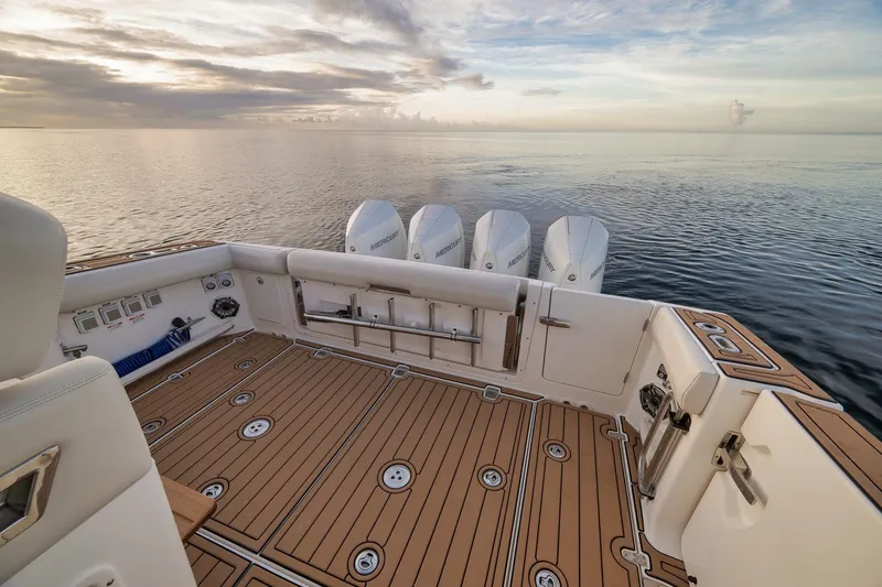 Slide: The Image of 2020 Boston Whaler 380 Realm boat deck with ocean view at sunset. - 29