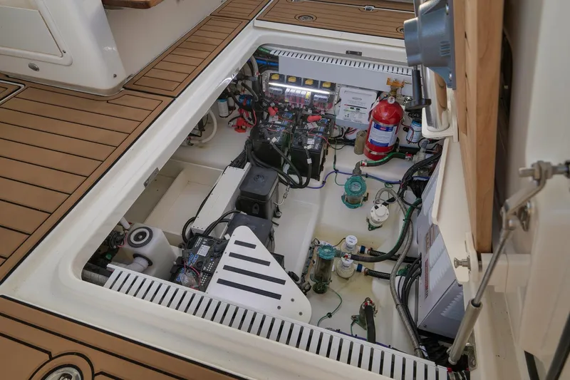 Slide: The Image of Engine compartment of 2020 Boston Whaler 380 Realm, showcasing wiring and equipment. - 32