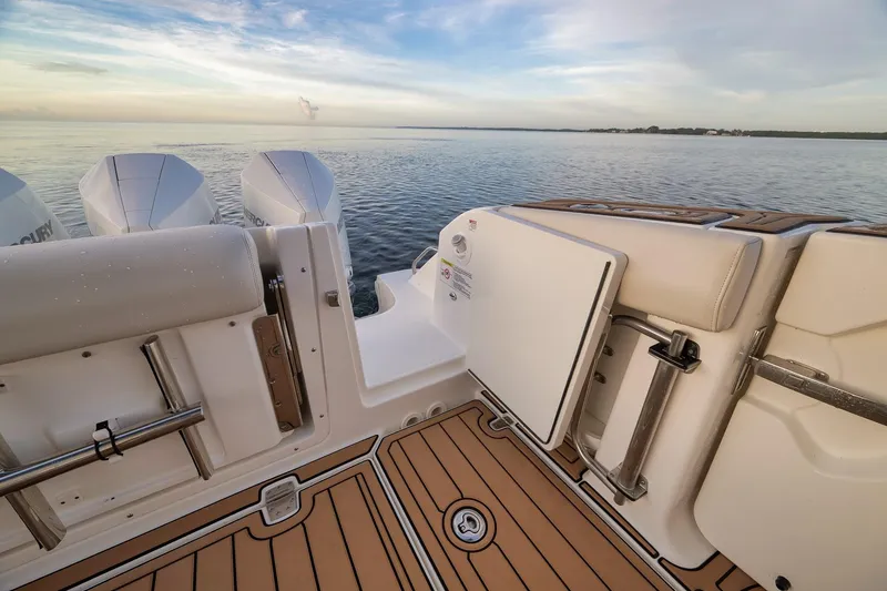 Slide: The Image of 2020 Boston Whaler 380 Realm boat deck with open hatch and ocean view. - 34