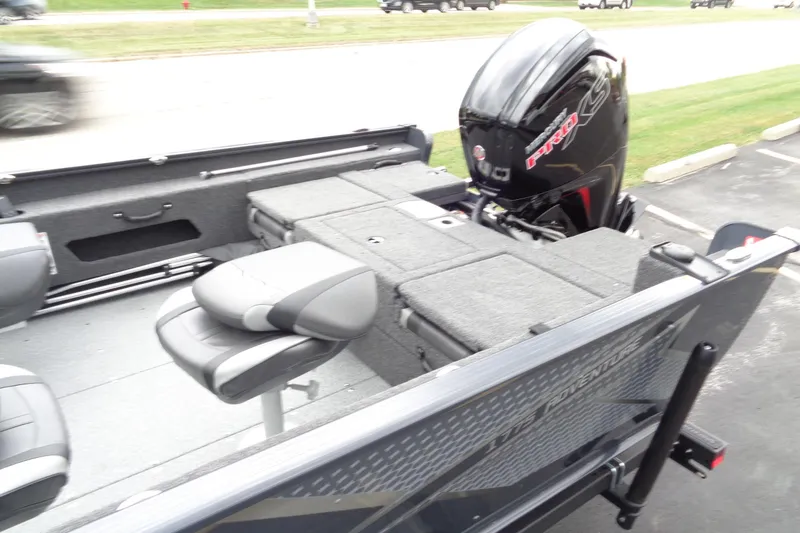 Slide: The Image of 2026 Lund 1775 Adventure Sport boat interior with seating and motor. - 6