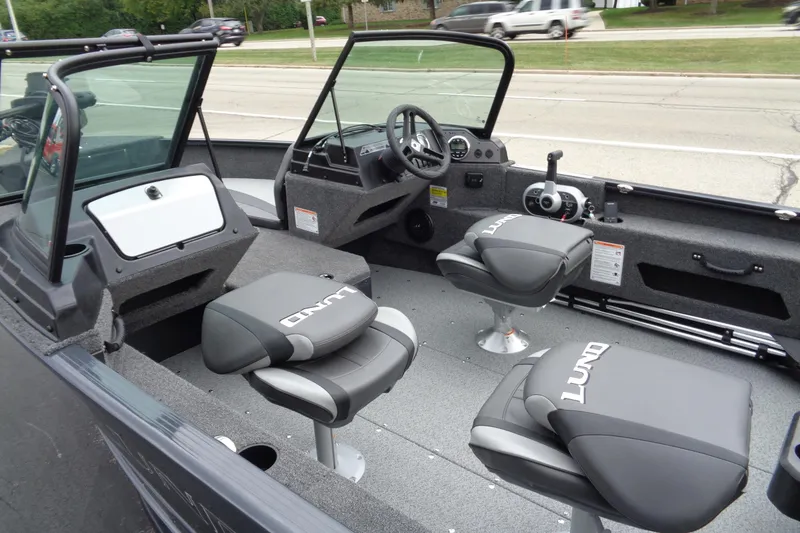 Slide: The Image of 2026 Lund 1775 Adventure Sport boat interior with sleek seating and modern controls. - 7