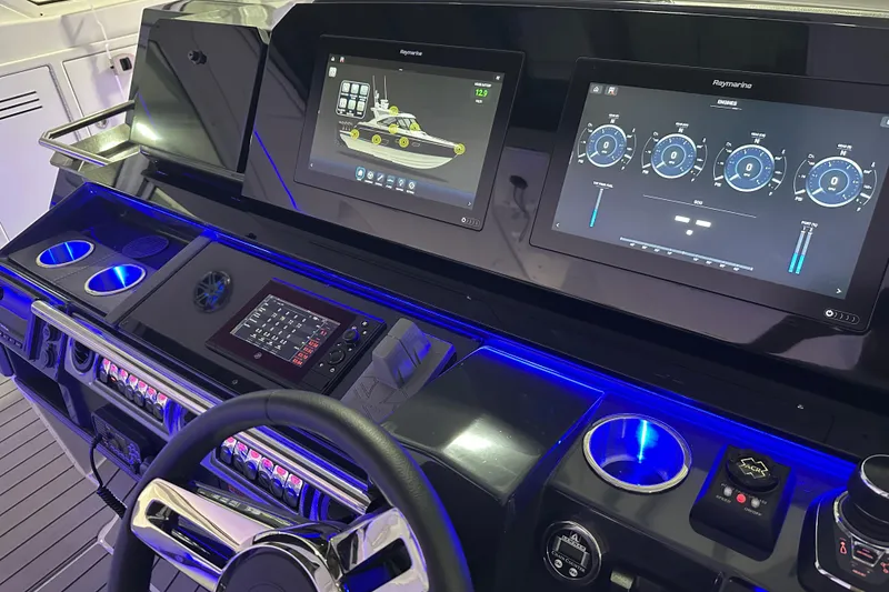 Slide: The Image of 2023 Formula 400 Super Sport Crossover dashboard with advanced navigation displays and illuminated controls. - 10