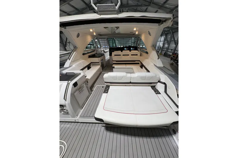 Slide: The Image of 2023 Formula 400 Super Sport Crossover luxury yacht interior with spacious seating and modern design. - 13