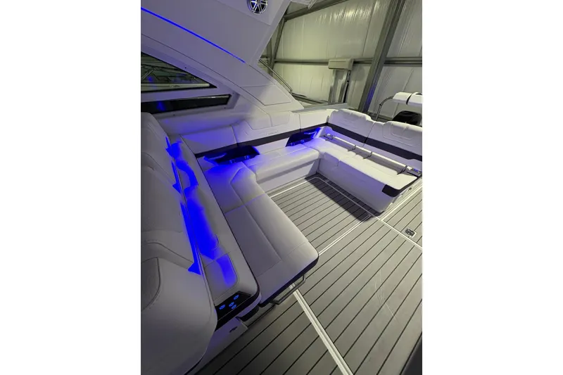 Slide: The Image of Luxurious interior of 2023 Formula 400 Super Sport Crossover with ambient blue lighting. - 17