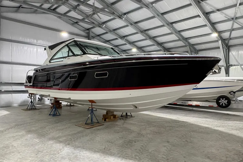 Slide: The Image of 2023 Formula 400 Super Sport Crossover boat in storage facility. - 2