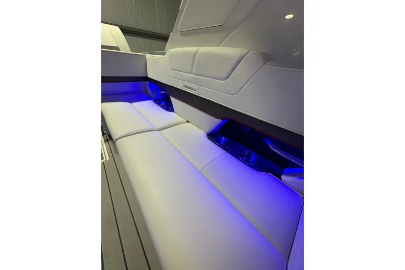 Slide: The Image of 2023 Formula 400 Super Sport Crossover interior with blue LED lighting and sleek seating. - 20