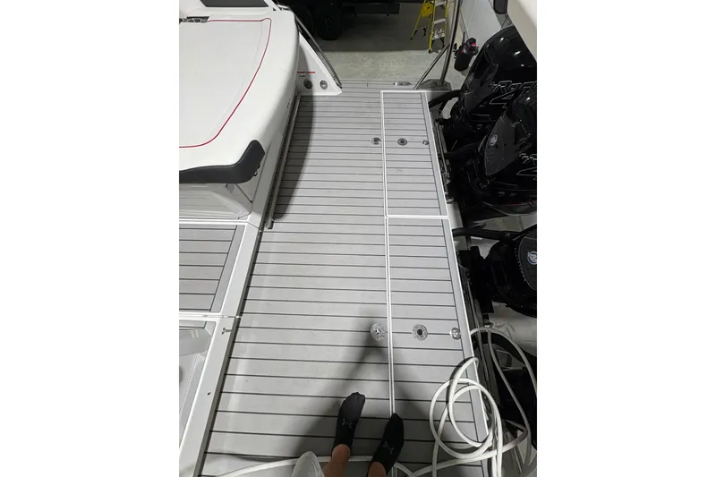 Slide: The Image of 2023 Formula 400 Super Sport Crossover boat deck with outboard motors. - 26