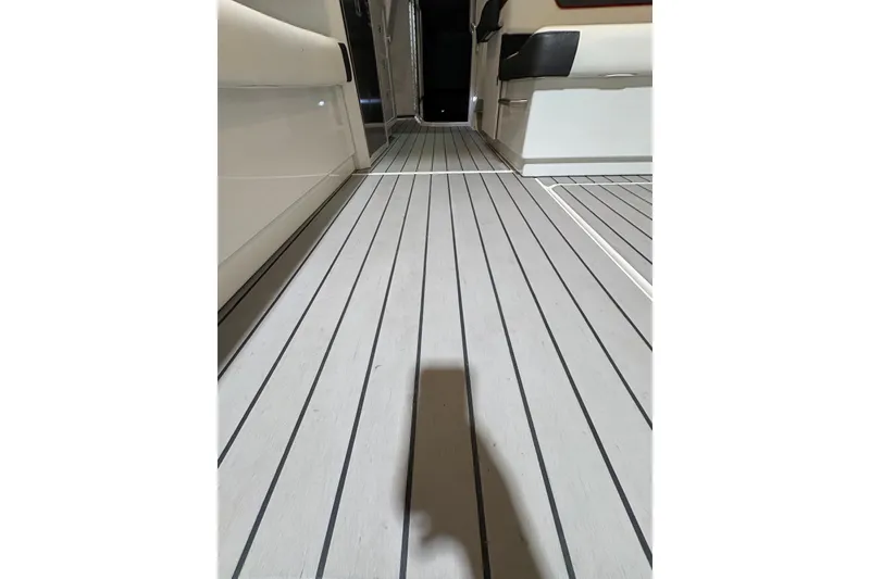 Slide: The Image of Interior view of 2023 Formula 400 Super Sport Crossover boat with sleek flooring design. - 27