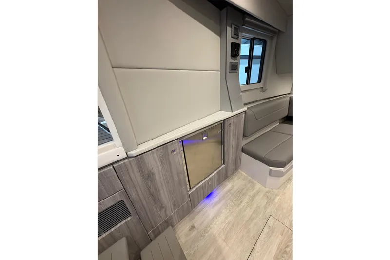 Slide: The Image of 2023 Formula 400 Super Sport Crossover interior with modern seating and cabinetry. - 29