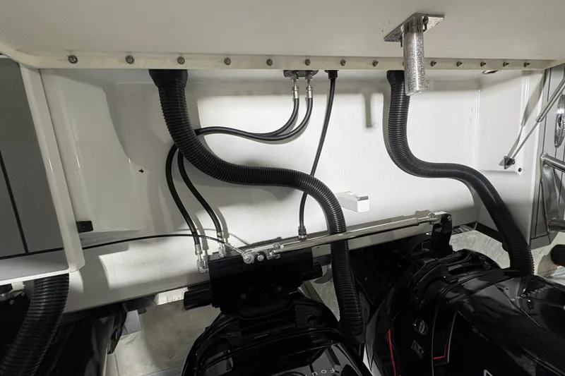 Slide: The Image of Engine compartment of 2023 Formula 400 Super Sport Crossover with visible hoses and components. - 36