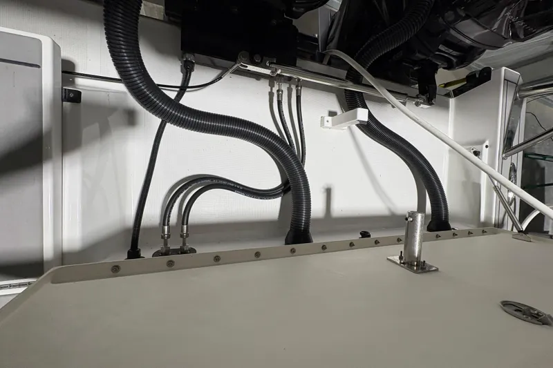 Slide: The Image of Engine compartment of 2023 Formula 400 Super Sport Crossover with visible hoses and fittings. - 37