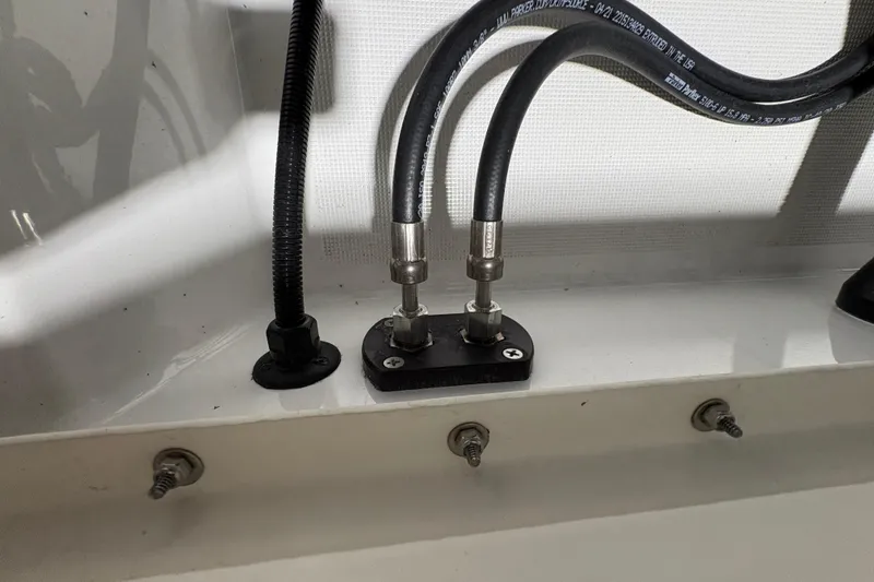 Slide: The Image of 2023 Formula 400 Super Sport Crossover boat wiring and hose connections detail. - 38