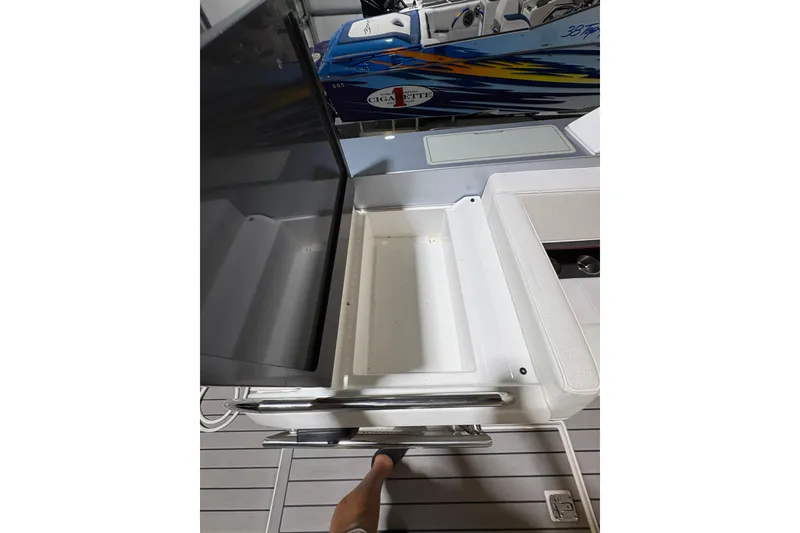 Slide: The Image of 2023 Formula 400 Super Sport Crossover boat interior with open storage compartment. - 39
