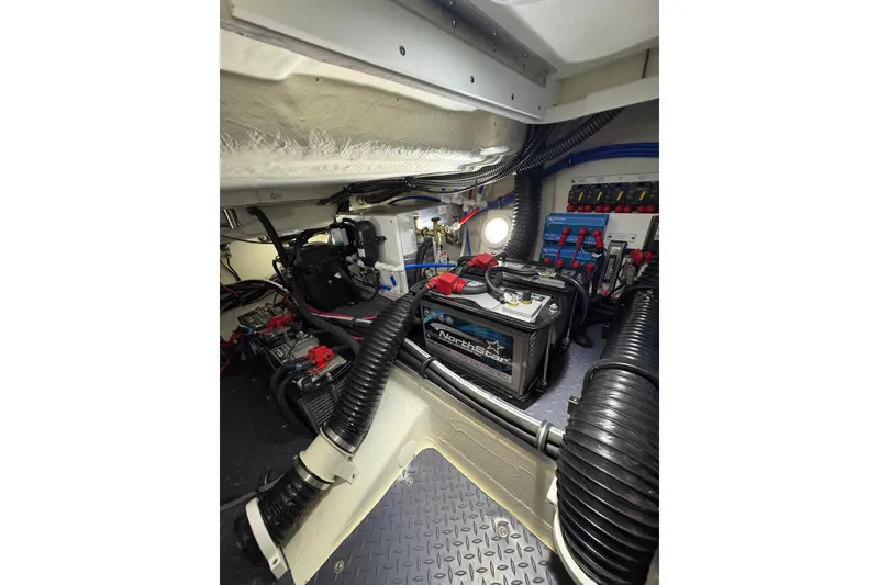 Slide: The Image of Engine room of 2023 Formula 400 Super Sport Crossover with batteries and wiring. - 44