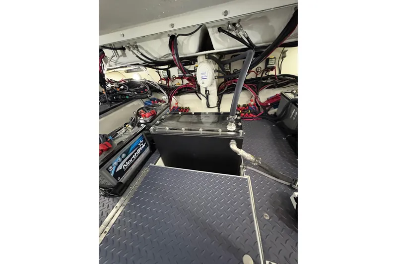 Slide: The Image of Engine room of 2023 Formula 400 Super Sport Crossover with batteries and wiring. - 45