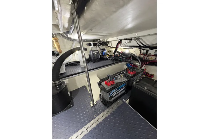 Slide: The Image of Engine room of 2023 Formula 400 Super Sport Crossover with batteries and wiring. - 46