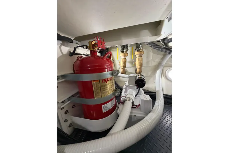 Slide: The Image of Engine room of 2023 Formula 400 Super Sport Crossover with fire extinguisher and plumbing. - 47