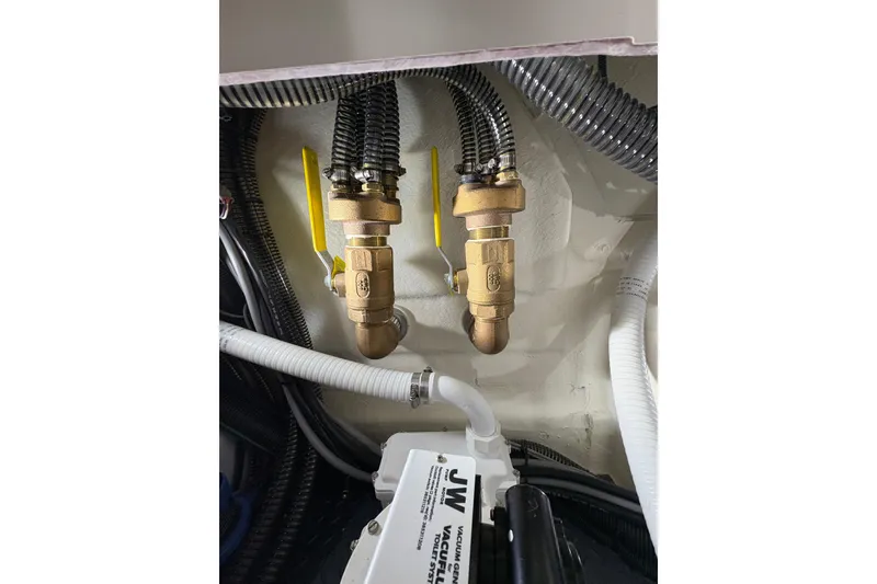 Slide: The Image of Engine room of 2023 Formula 400 Super Sport Crossover with brass valves and hoses. - 48