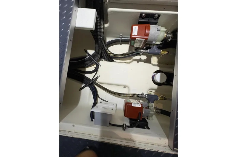 Slide: The Image of Engine compartment of 2023 Formula 400 Super Sport Crossover with visible wiring and components. - 49