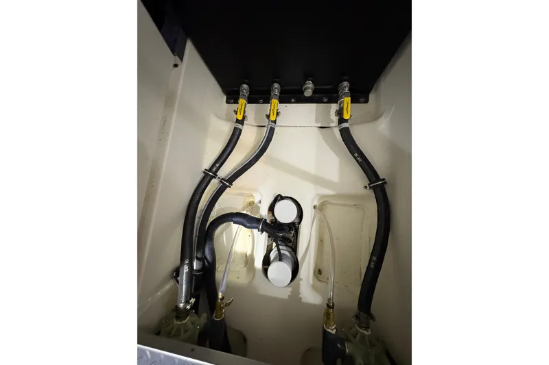 Slide: The Image of Engine compartment of 2023 Formula 400 Super Sport Crossover with visible hoses and fittings. - 50