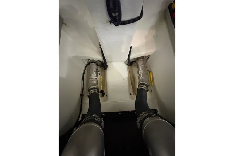 Slide: The Image of Engine compartment of 2023 Formula 400 Super Sport Crossover with visible hoses and fittings. - 51