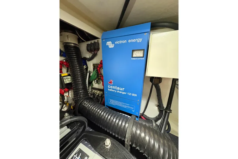 Slide: The Image of 2023 Formula 400 Super Sport Crossover engine room with Victron Energy Centaur battery charger. - 52