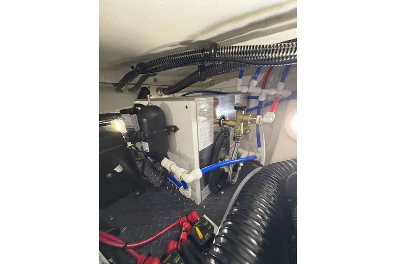 Slide: The Image of Engine compartment of 2023 Formula 400 Super Sport Crossover with wiring and plumbing. - 53