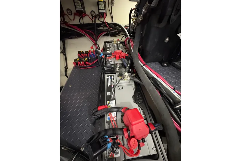 Slide: The Image of Battery compartment of 2023 Formula 400 Super Sport Crossover with wiring and connections. - 54