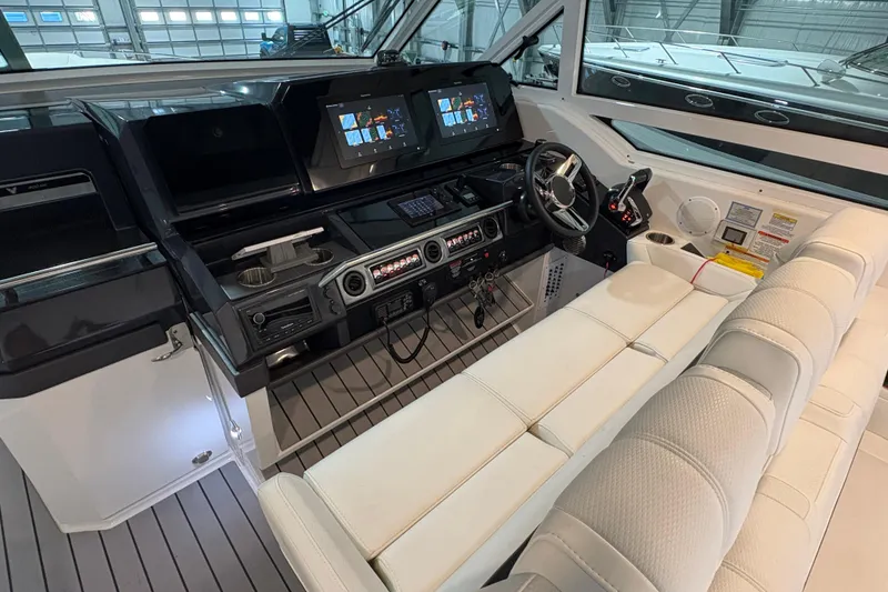 Slide: The Image of 2023 Formula 400 Super Sport Crossover cockpit with modern controls and plush seating. - 9