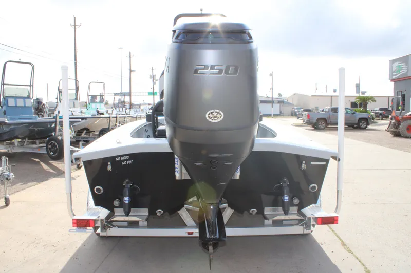 Slide: The Image of 2026 Freedom Boats 23' Warrior deck view, showcasing storage compartments and seating area. - 5