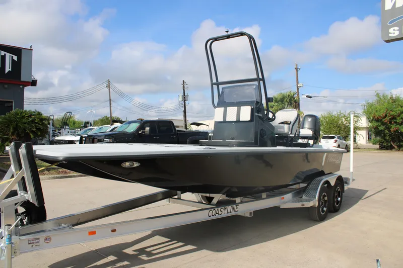 Slide: The Image of 2026 Freedom Boats 23' Warrior interior with cushioned seating and storage compartment. - 8