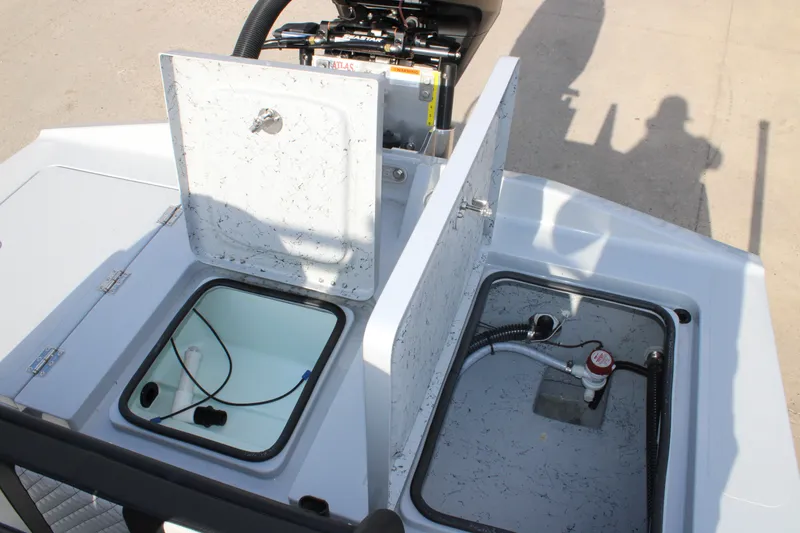 Slide: The Image of 2026 Freedom Boats 23' Warrior with dual seats, parked outdoors under clear skies. - 11