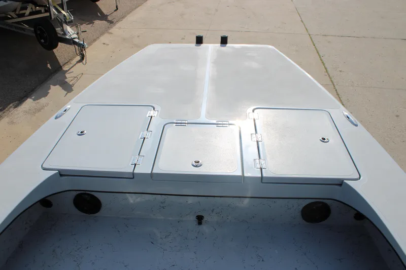 Slide: The Image of 2026 Freedom Boats 23' Warrior with powerful outboard motor, parked outdoors. - 15