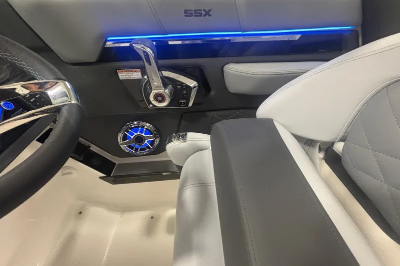 Slide: The Image of 2026 Chaparral 8 SSX boat interior with modern controls and blue LED lighting. - 17