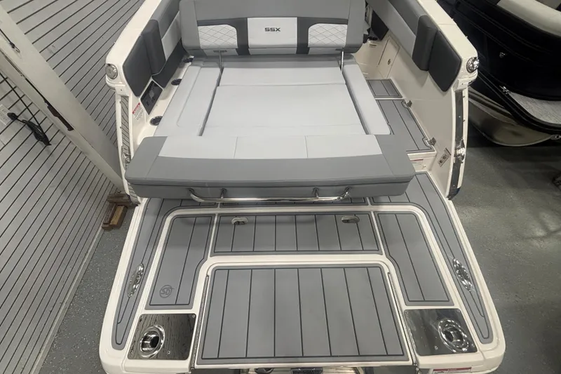 Slide: The Image of 2026 Chaparral 8 SSX boat interior with sleek gray seating and deck design. - 21