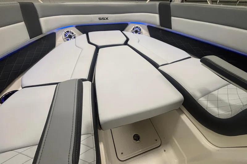 Slide: The Image of 2026 Chaparral 8 SSX boat interior with luxurious seating and ambient lighting. - 23