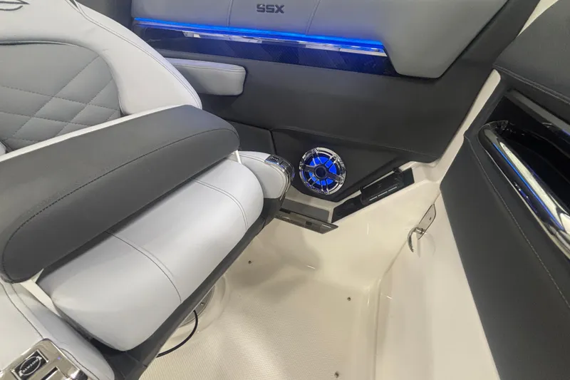 Slide: The Image of 2026 Chaparral 8 SSX interior with luxury seating and illuminated speaker detail. - 24