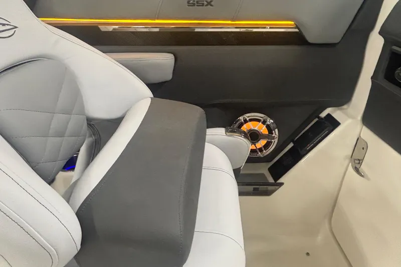 Slide: The Image of Interior of 2026 Chaparral 8 SSX boat with luxury seating and speaker system. - 27