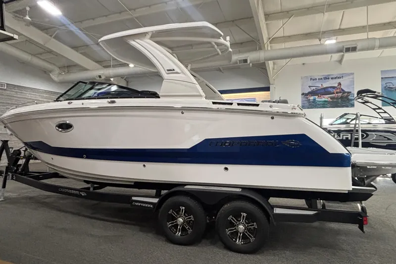 Slide: The Image of 2026 Chaparral 8 SSX boat on trailer in showroom, side view. - 5